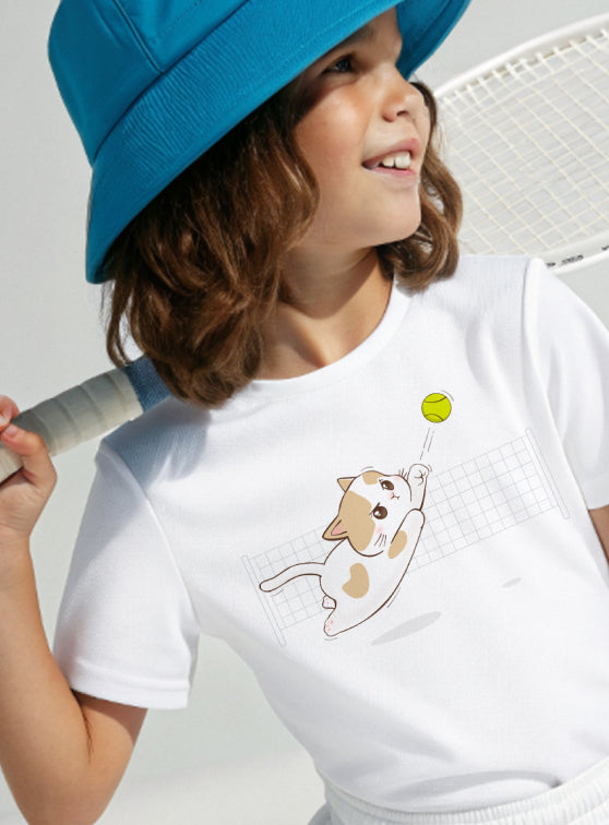Child wearing a white t-shirt with a cat graphic and a blue hat, holding a tennis racket. Title text reads, 