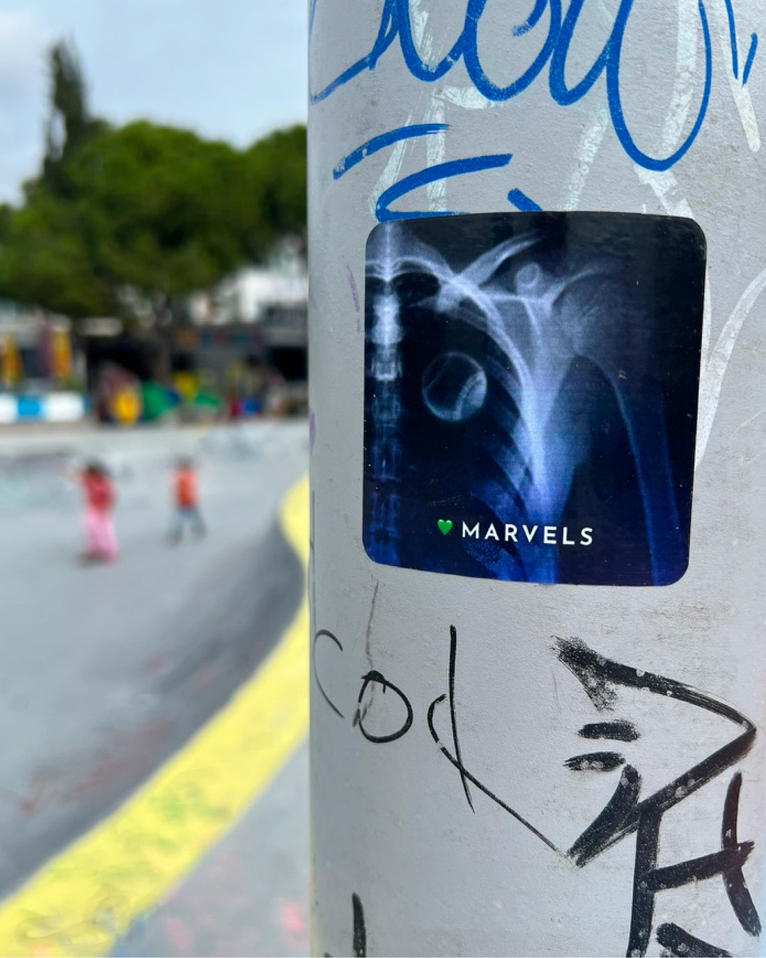 Tennis sticker on pole at skatepark