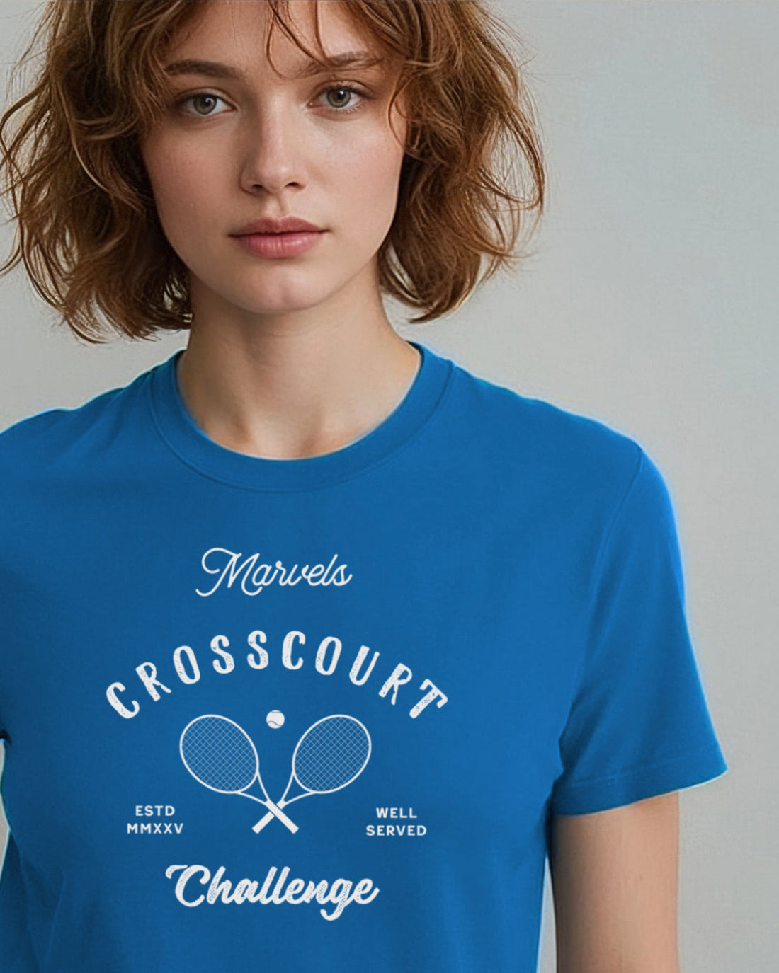 Person wearing a blue t-shirt with 'Marvels Crosscourt Challenge' text and logo.