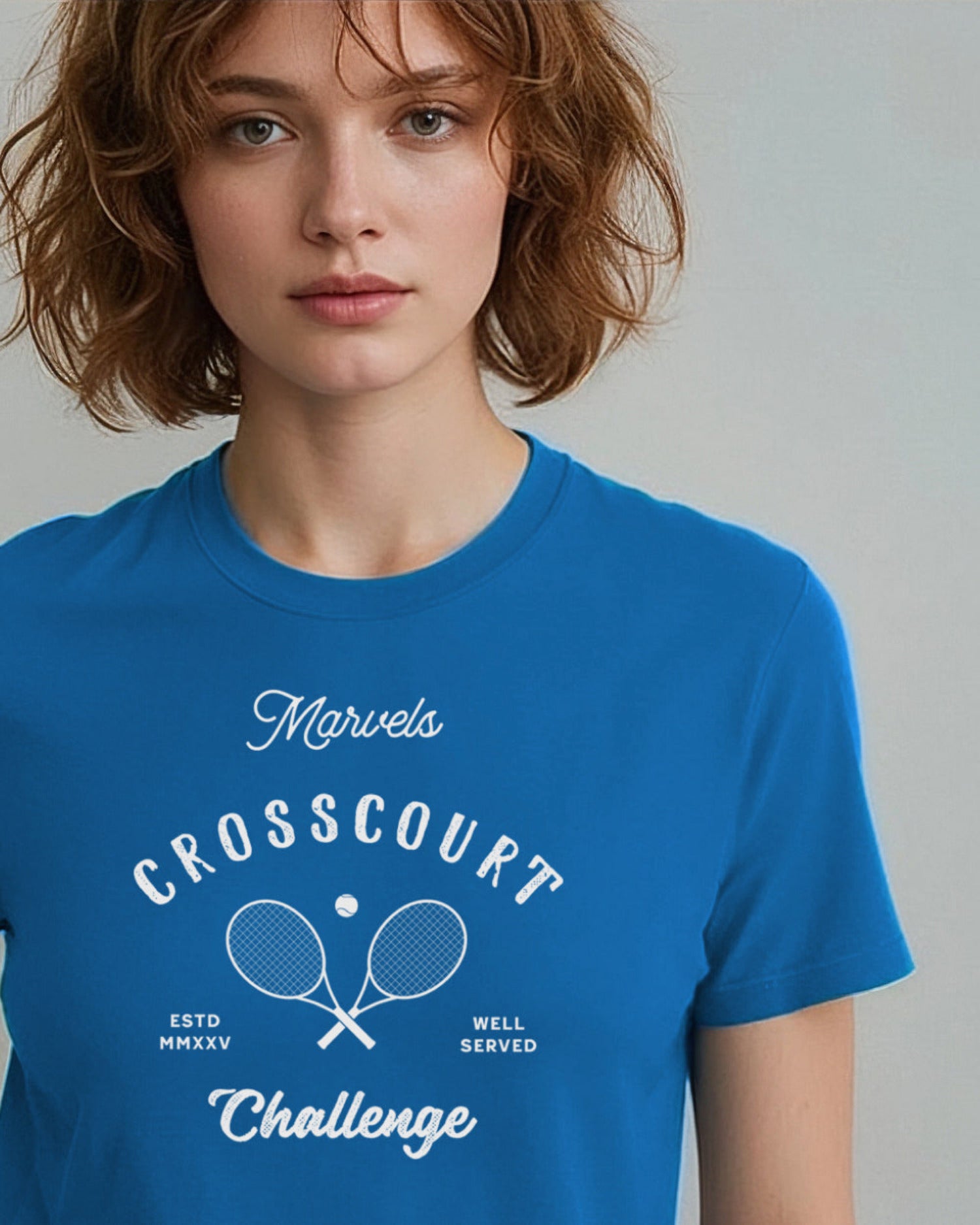 Person wearing a blue t-shirt with 'Marvels Crosscourt Challenge' text and logo.