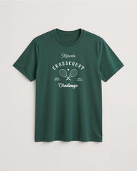 Green t-shirt with white text and graphics on a light gray background
