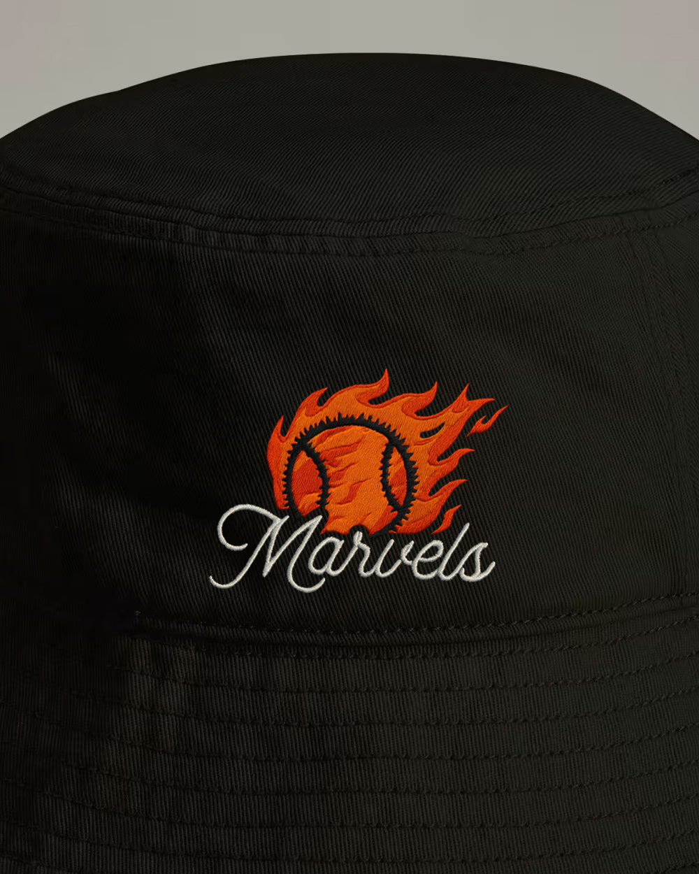 Black bucket hat with 'Marvels' script logo featuring a flaming tennis ball.