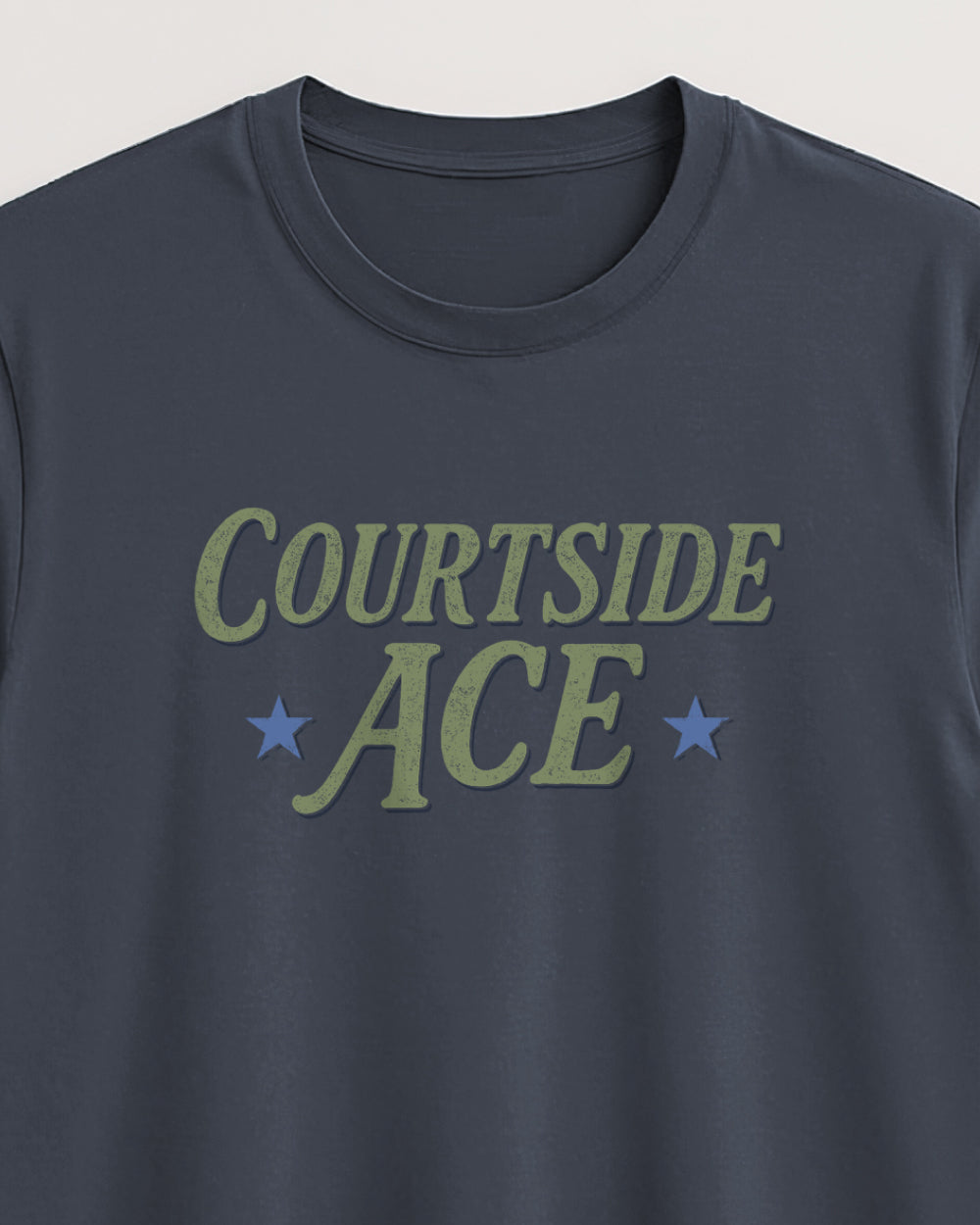 Grey blue t-shirt with 'Courtside Ace' text and stars on a light background