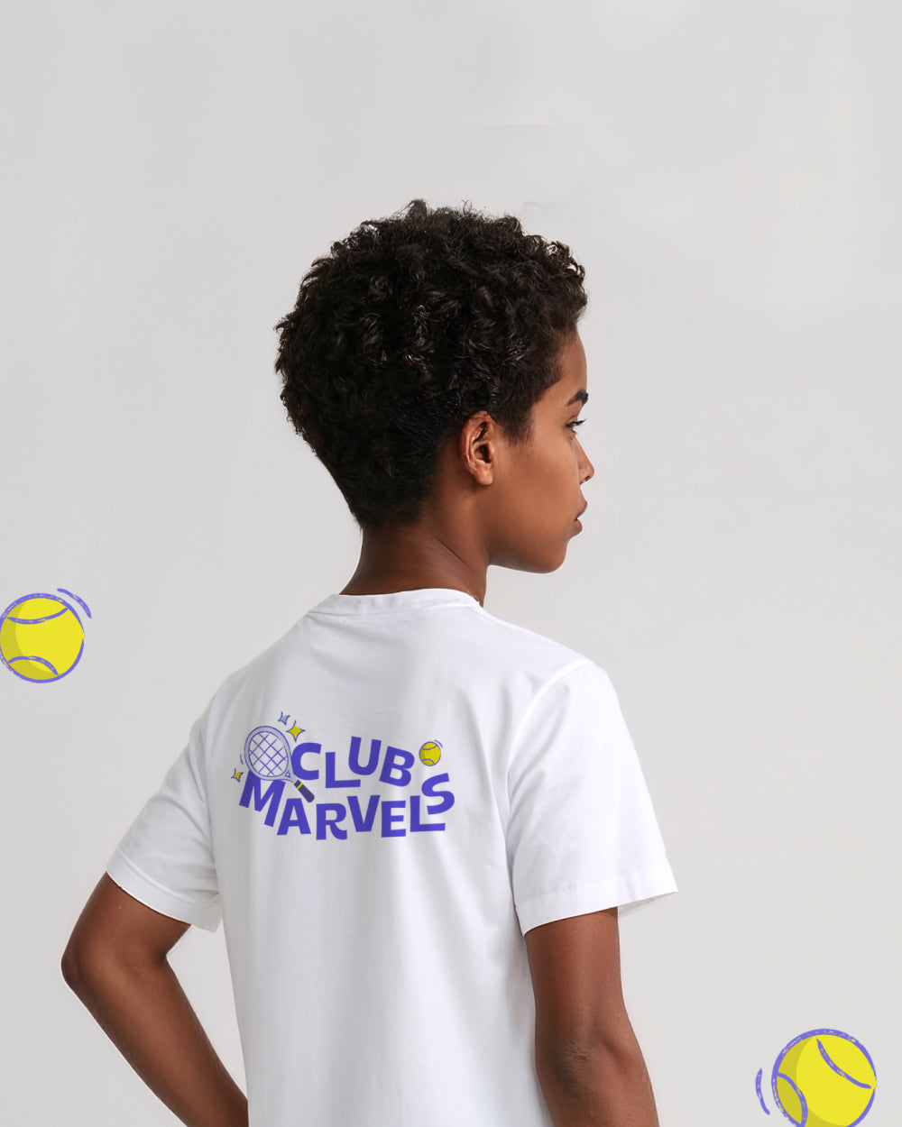 Kid wearing a white tennis t-shirt with 'Club Marvels' text on the back