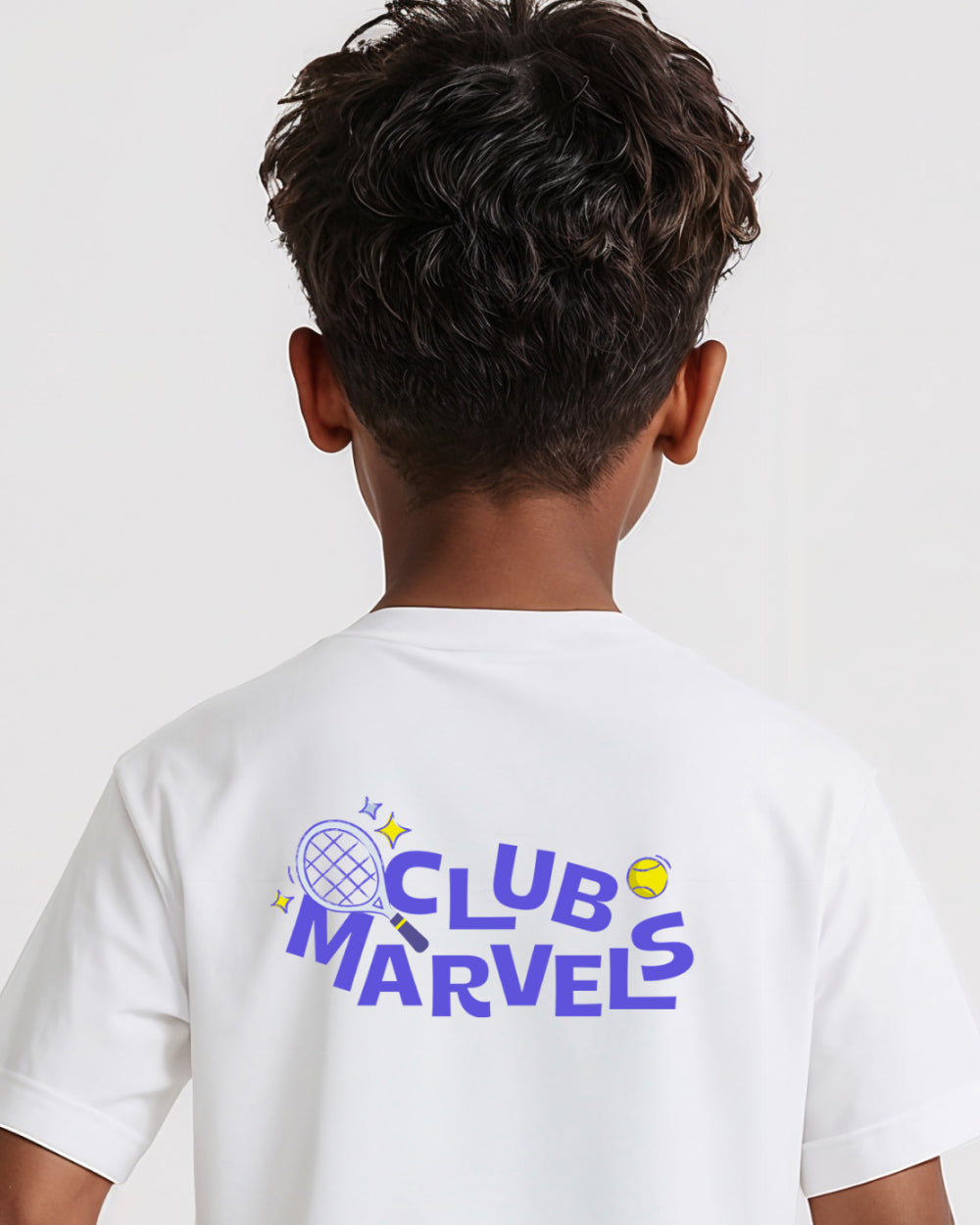 Child wearing a white tennis t-shirt with 'Club Marvels' text on the back