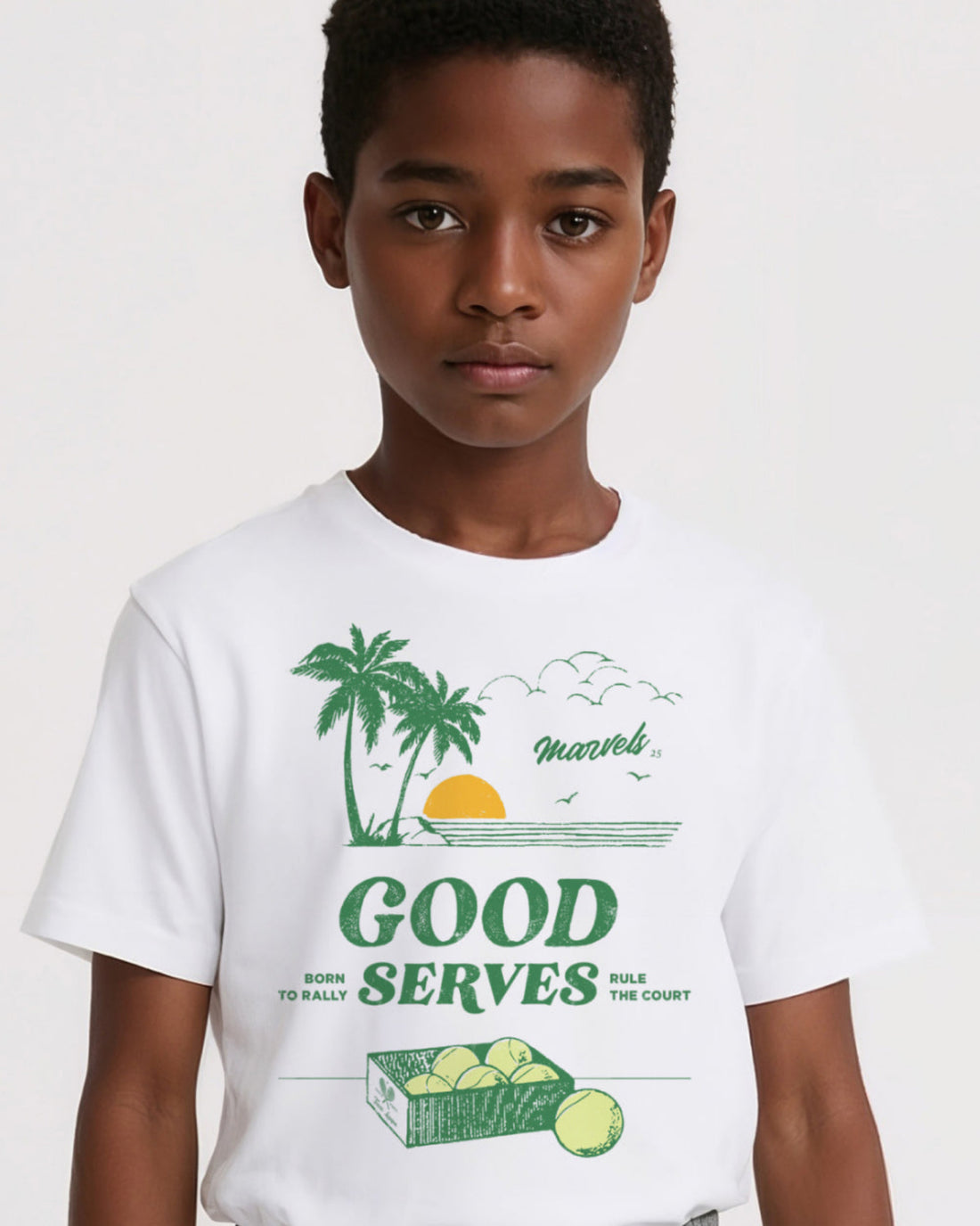 Child wearing a white t-shirt with tennis graphics
