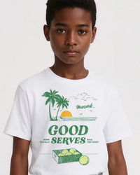 Child wearing a white t-shirt with tennis graphics