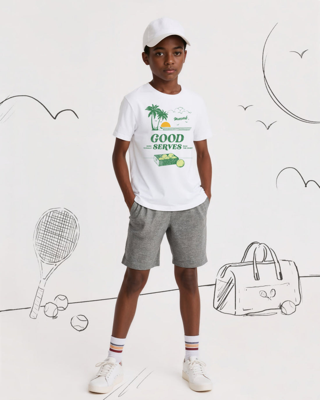 Child wearing a white t-shirt with graphics and text, standing against a white background with tennis-related illustrations.