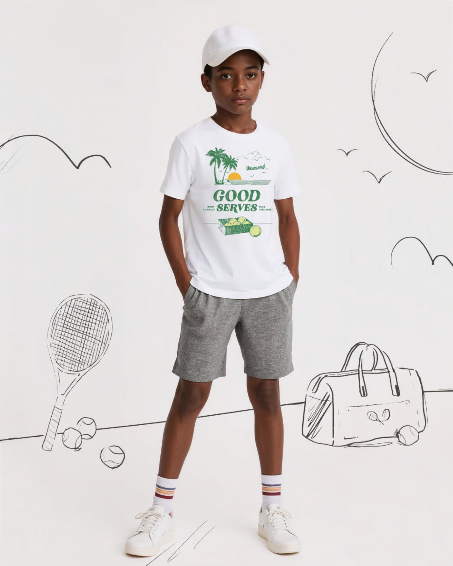 Child wearing a white t-shirt with graphics and text, standing against a white background with tennis-related illustrations.