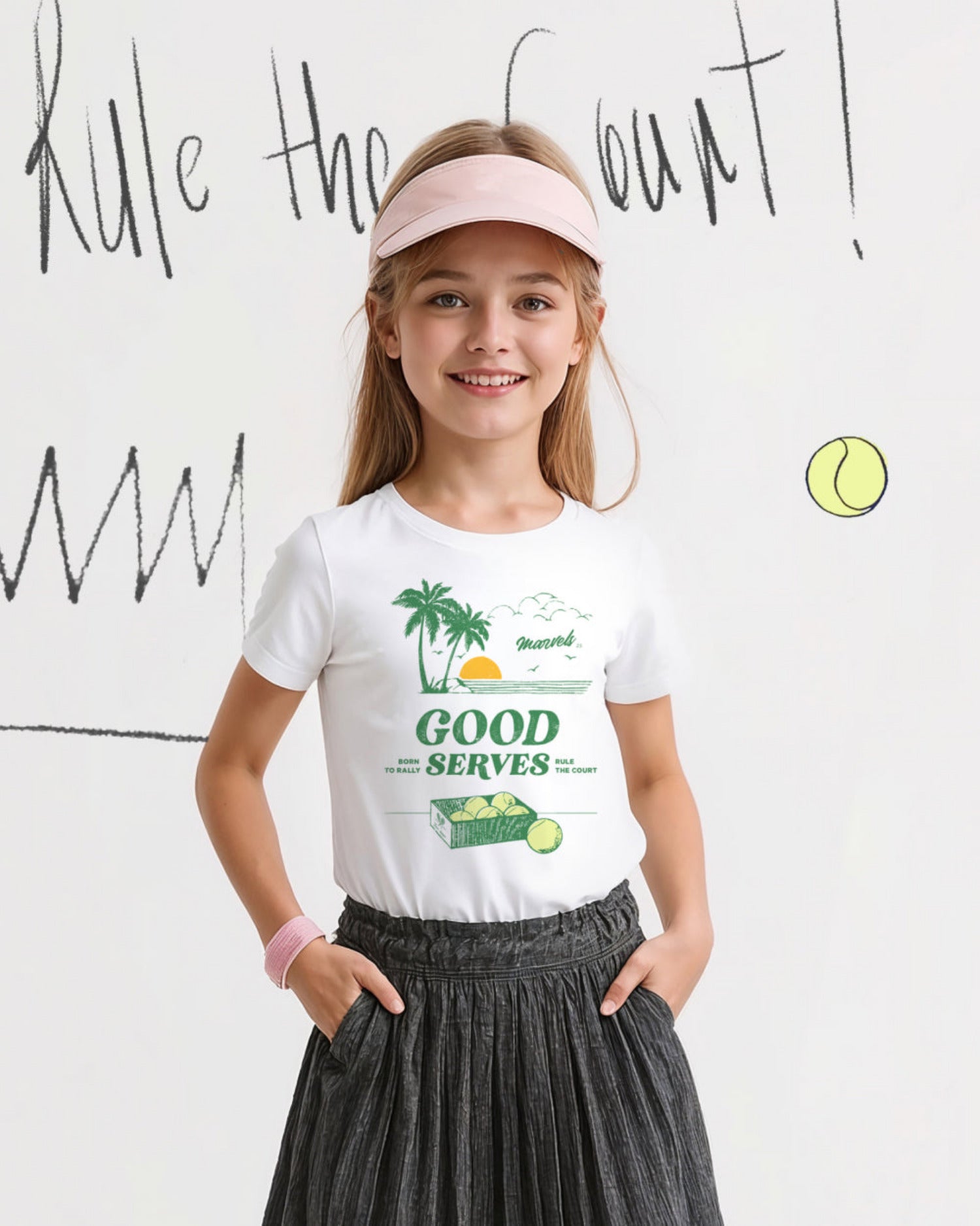 Young girl wearing a white t-shirt with a tennis-themed graphic