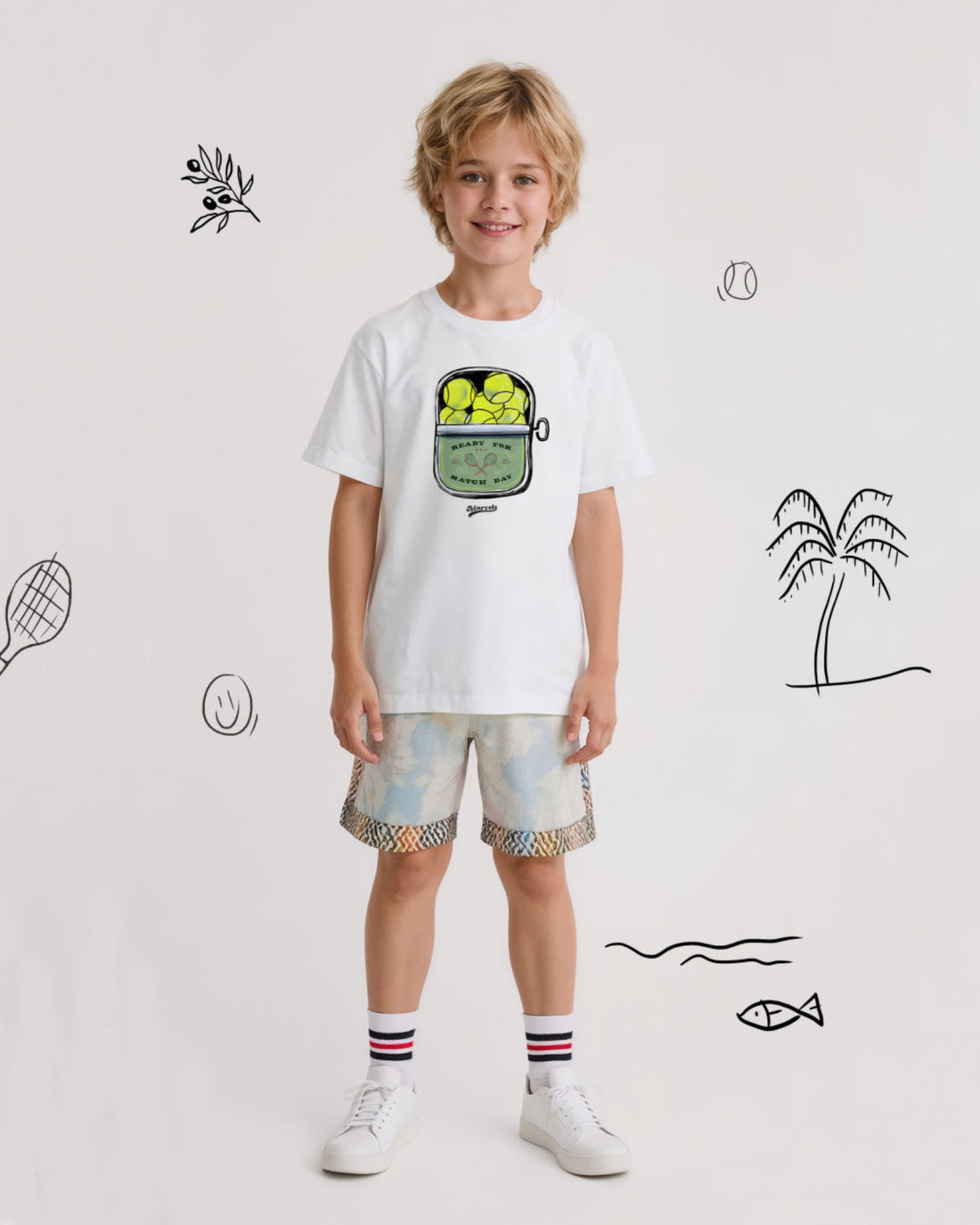 Child wearing a white t-shirt with a tennis graphic design