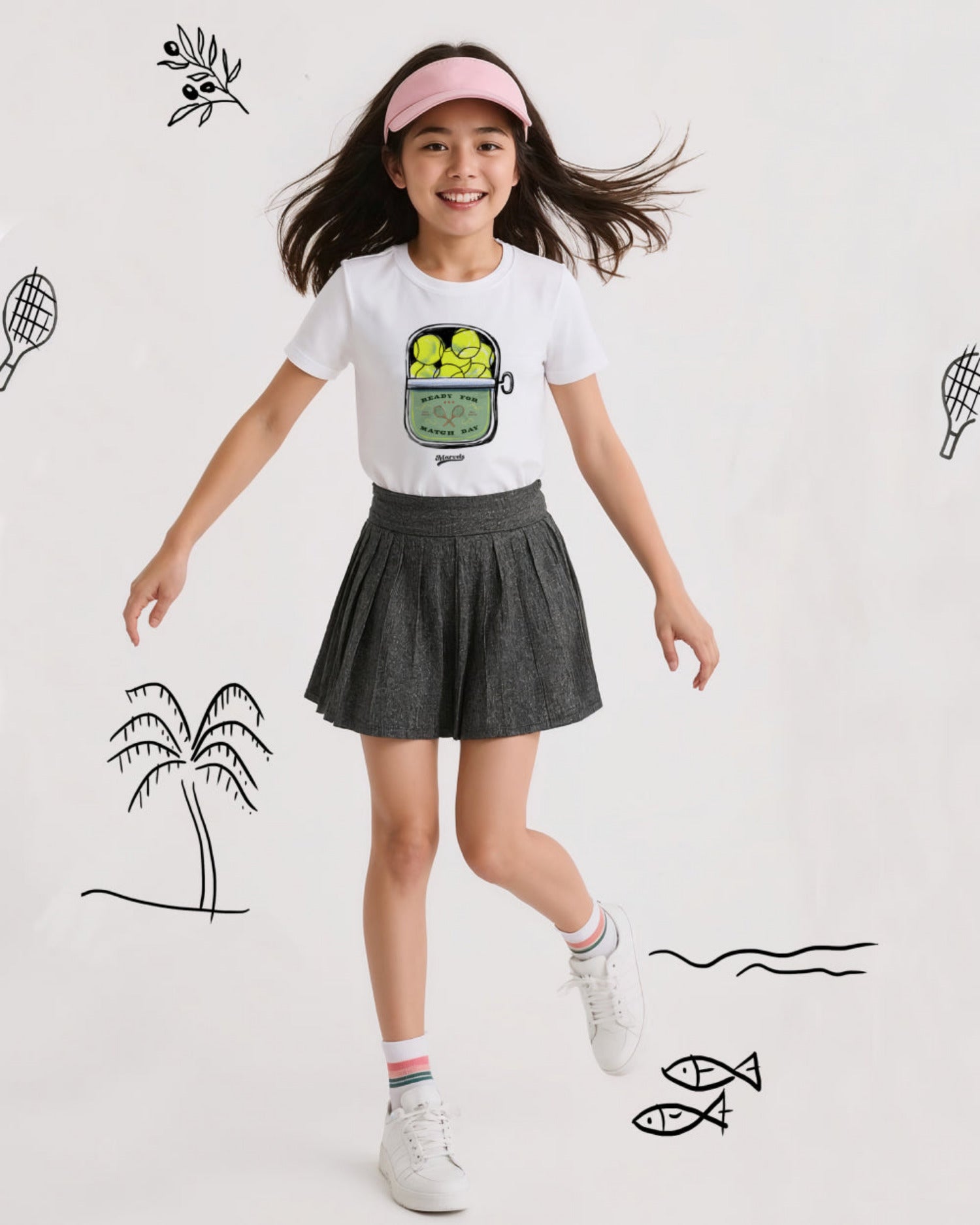 Young girl in sports-themed outfit with tennis graphics