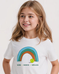 Young girl wearing a white tennis t-shirt with a rainbow design