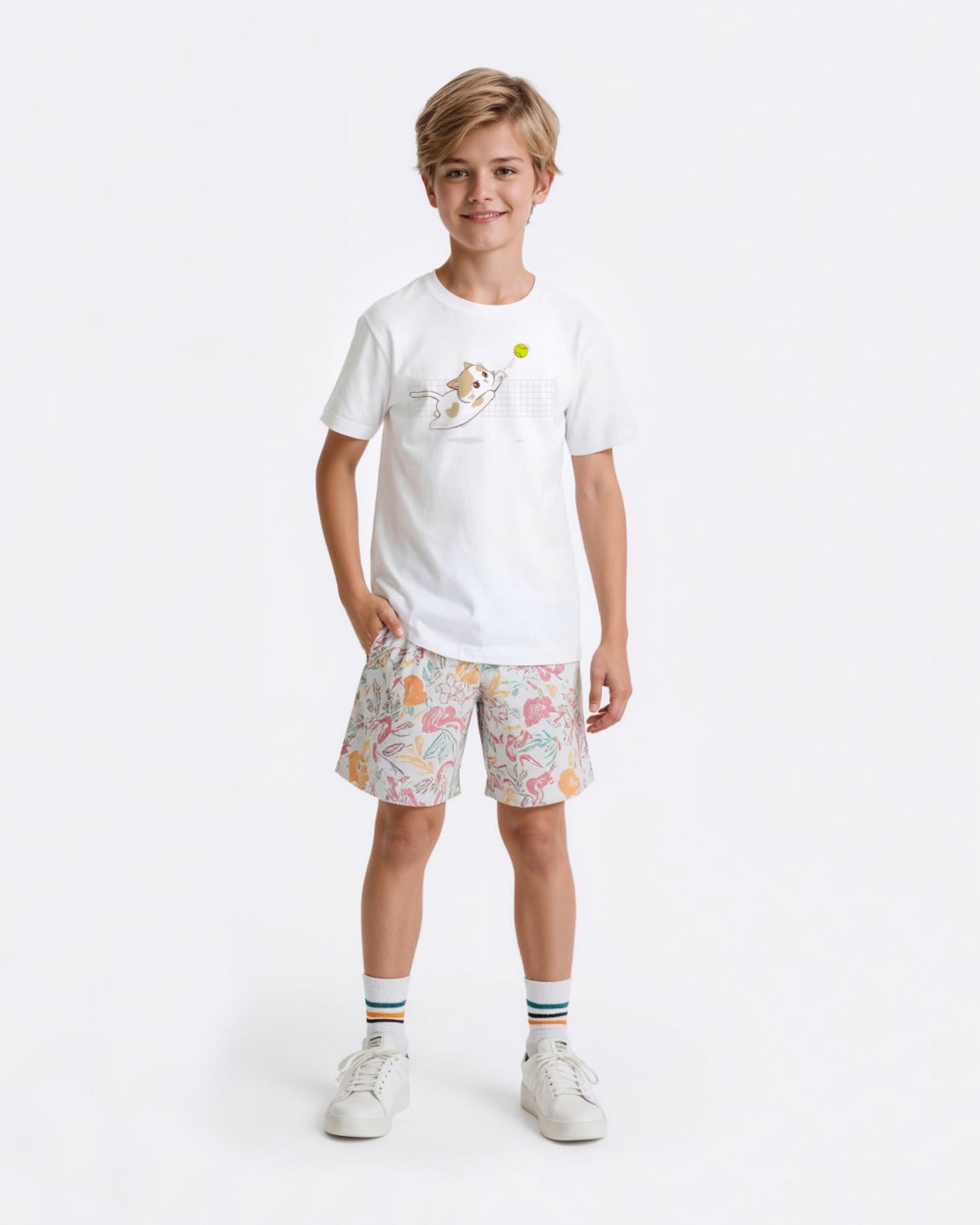 Child wearing a white tennis t-shirt with a cat graphic and patterned shorts