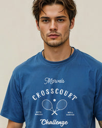 Man wearing a blue tennis t-shirt with 'Crosscourt Challenge' text and logo