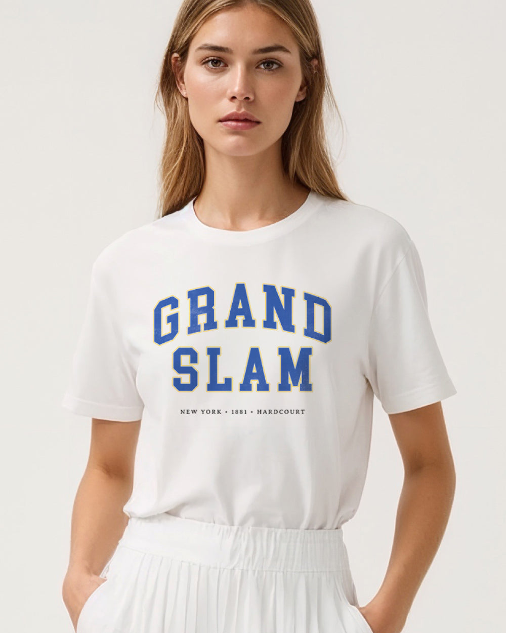 Model wearing a white t-shirt with 'Grand Slam' text on a plain background
