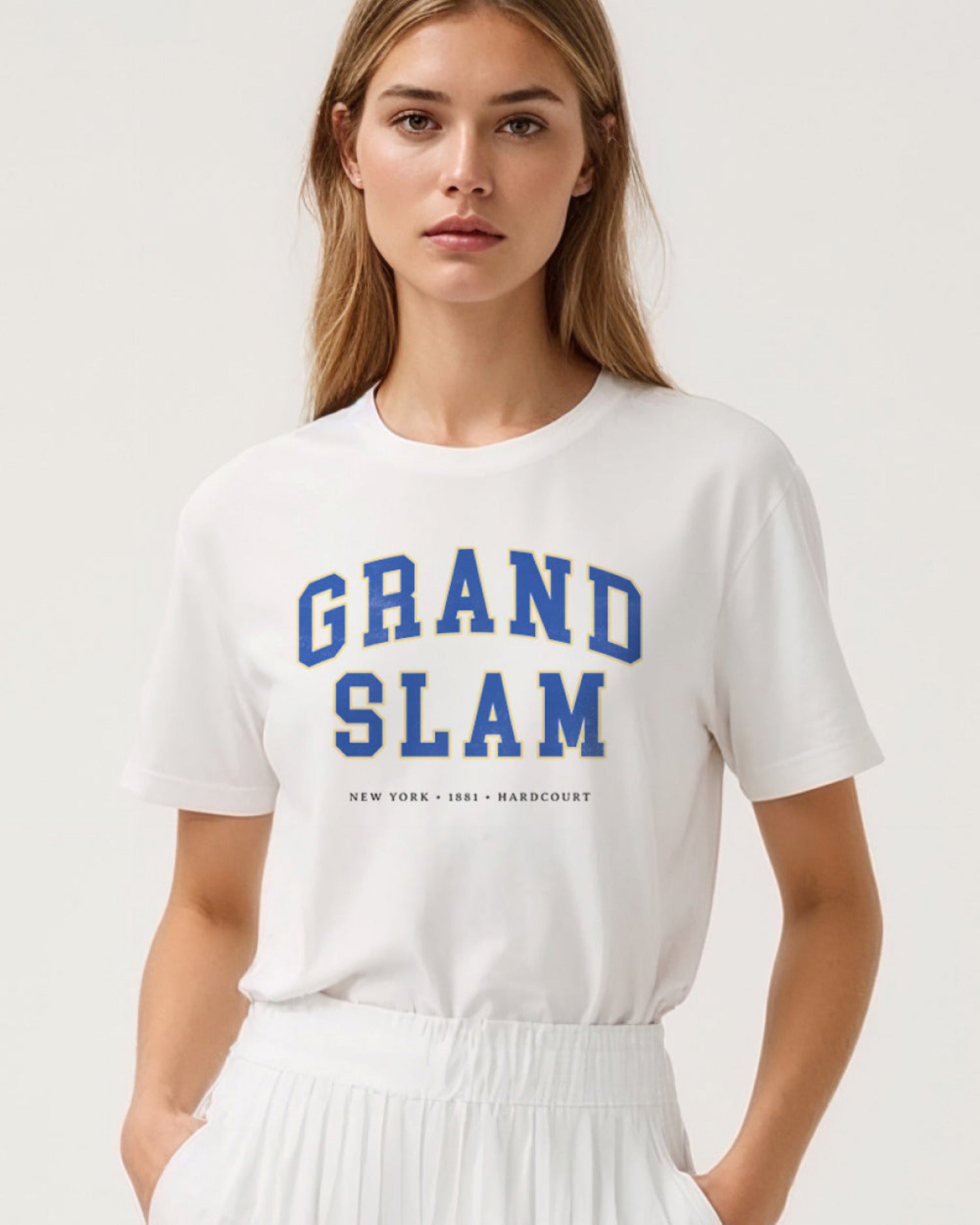 Model wearing a white t-shirt with 'Grand Slam' text on a plain background
