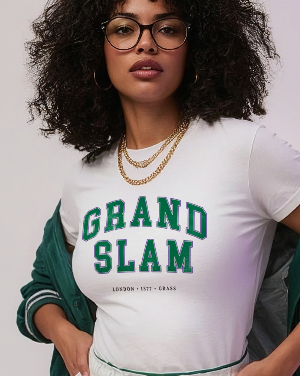 Person wearing a white t-shirt with 'Grand Slam' text