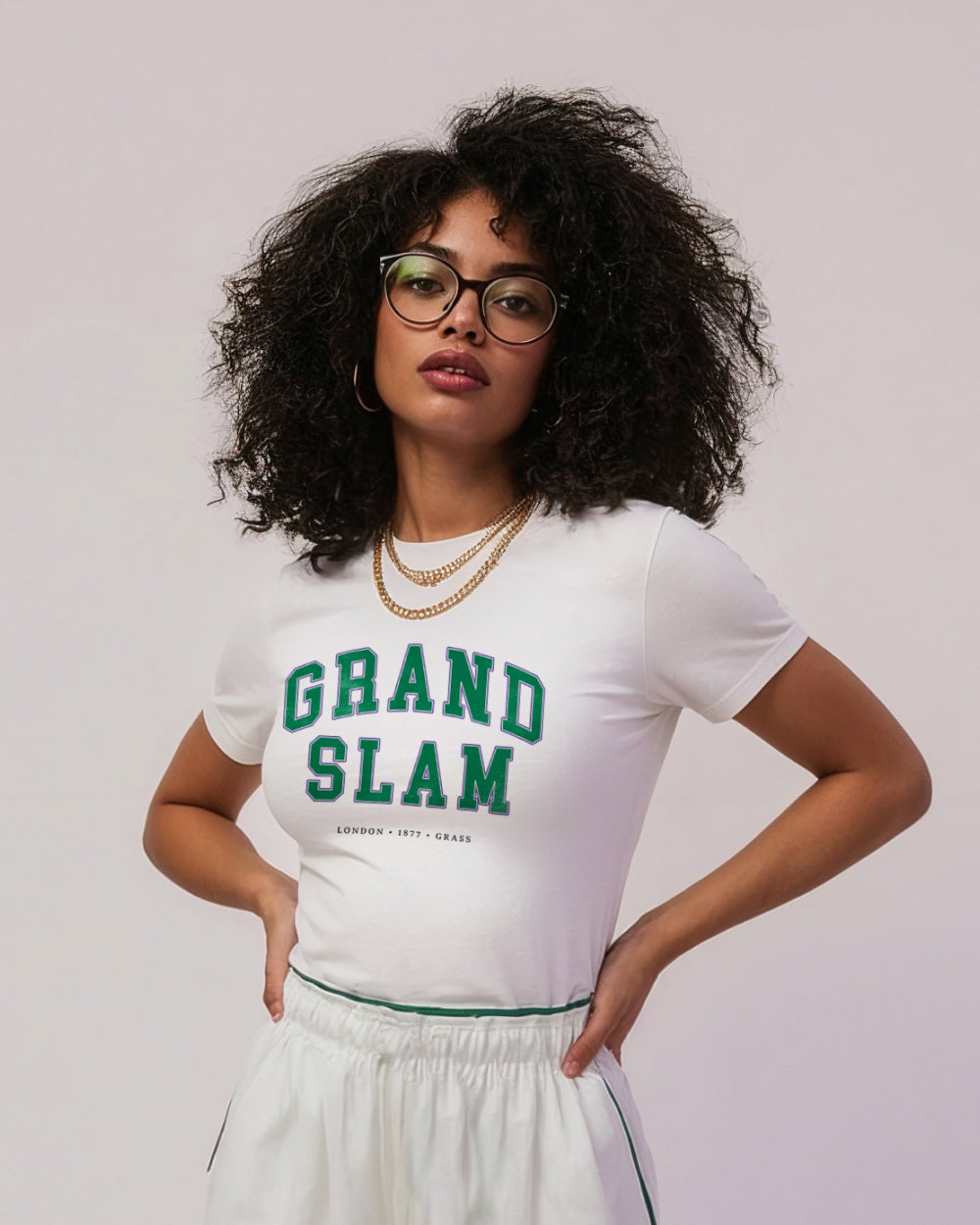 Person wearing a white t-shirt with 'GRAND SLAM' text
