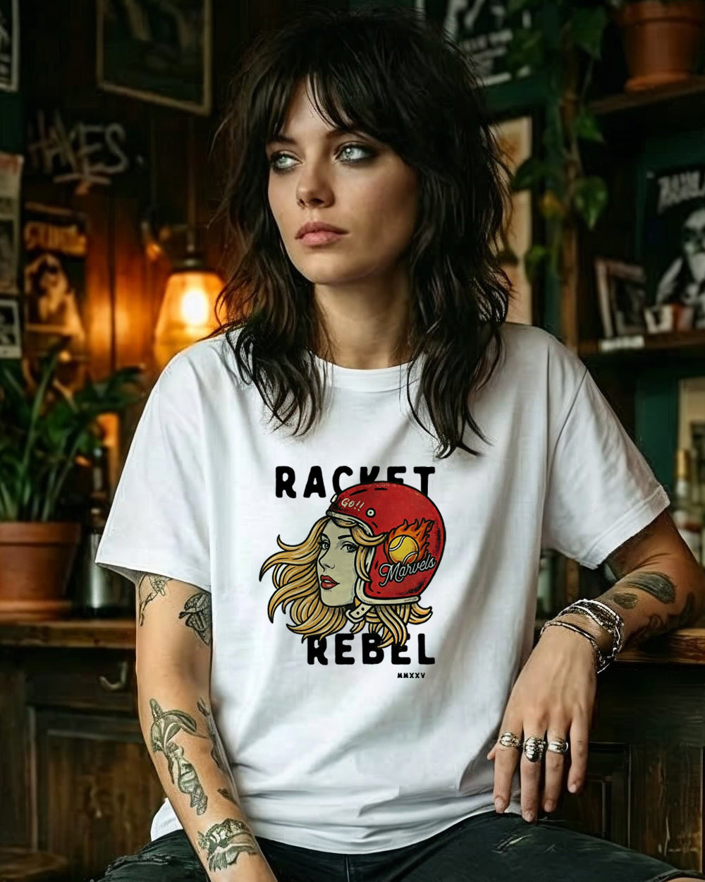 Woman wearing a white t-shirt with a graphic design and text in a casual setting.