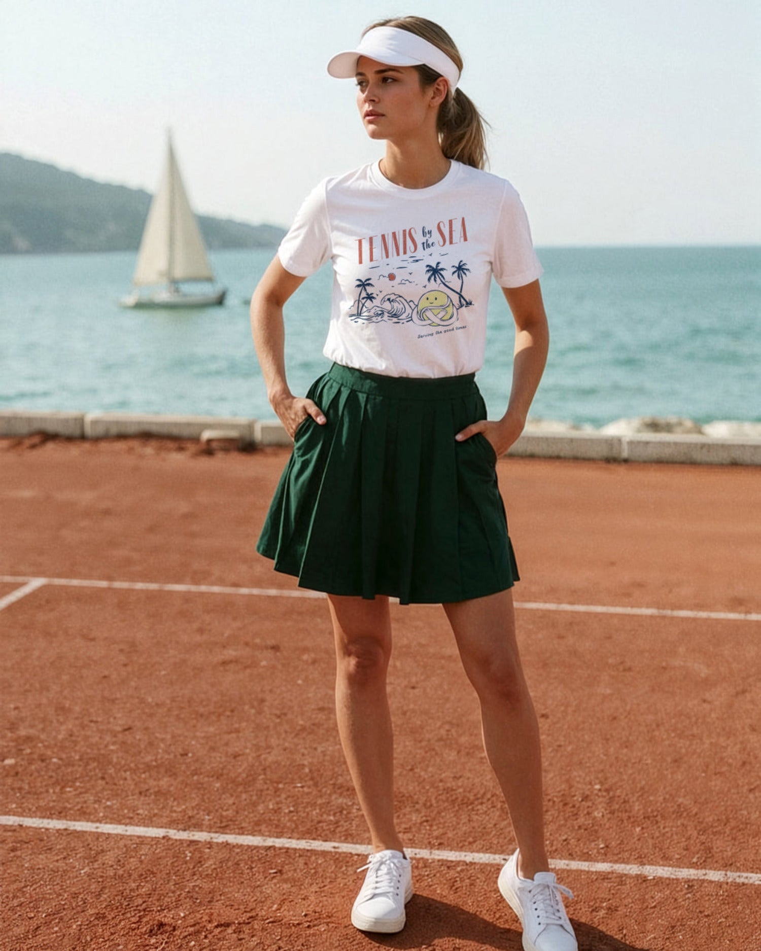 Woman in a tennis-themed outfit standing on a tennis court with a sailboat in the background.